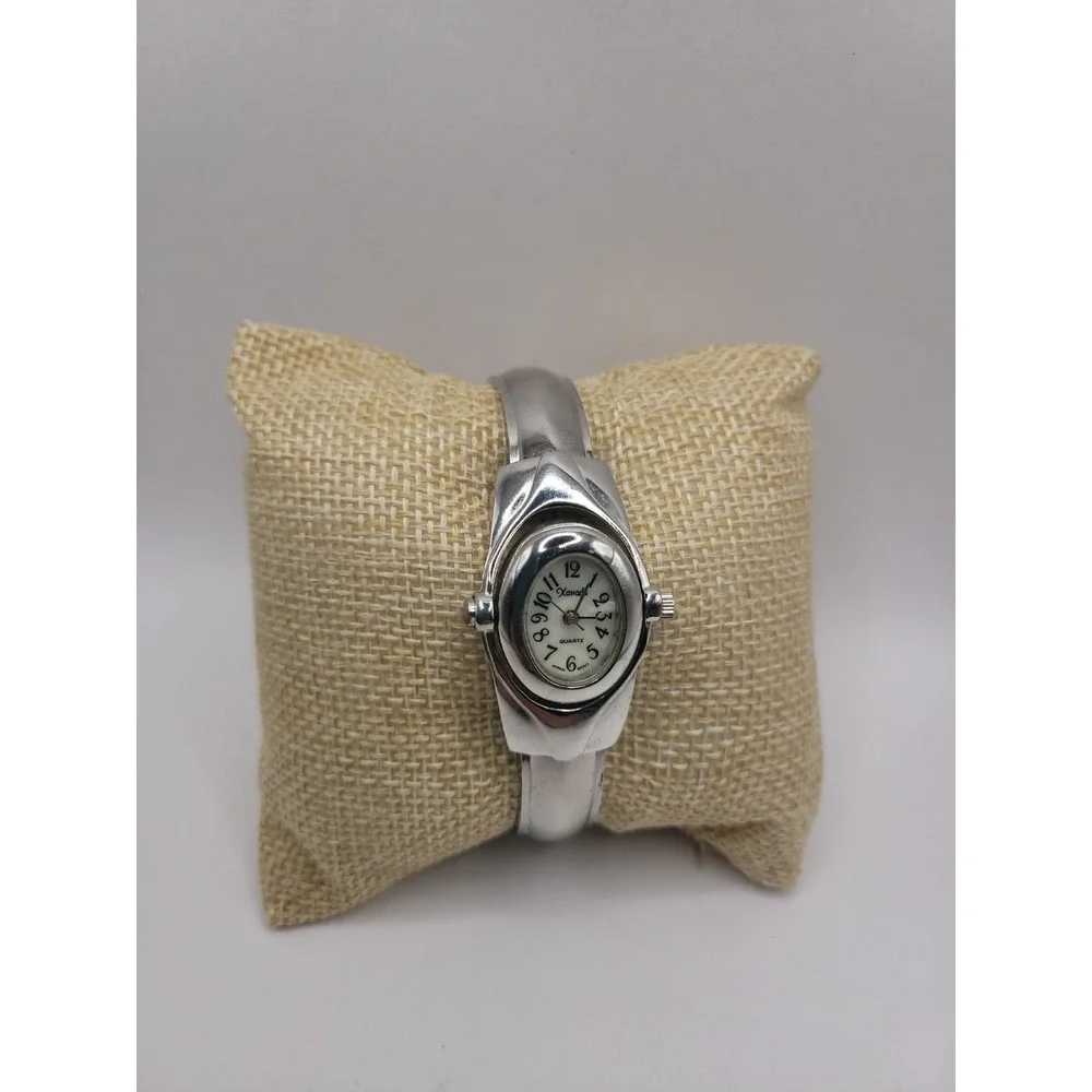 Xanadu Women's Silver Tone Hinged Cuff Bangle Quartz Watch Oval Dial Reverse